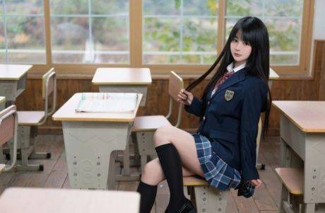 Pretty schoolgirl does a hot tease wearing a slutty uniform and stockings - #6