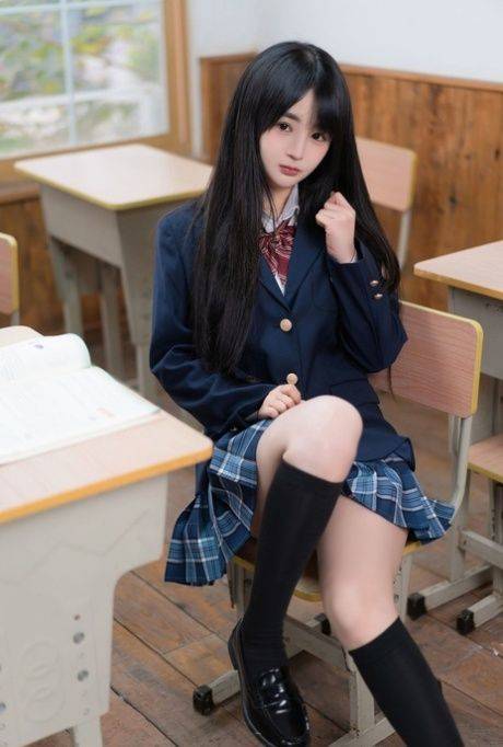 Pretty schoolgirl does a hot tease wearing a slutty uniform and stockings - #4