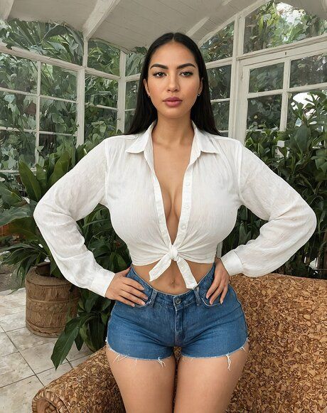 Latina girl with big natural tits strips naked in a greenhouse - #5