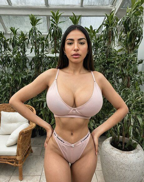 Latina girl with big natural tits strips naked in a greenhouse - #10