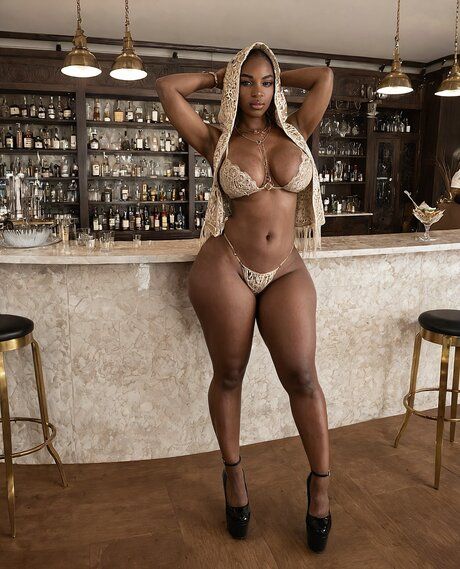 Black solo girl models non nude and nude poses in a bar setting - #7