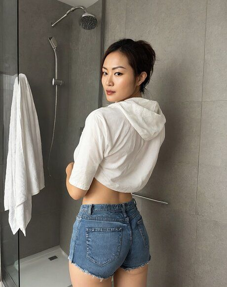 Beautiful Asian girl gets completely naked while taking a shower - #2