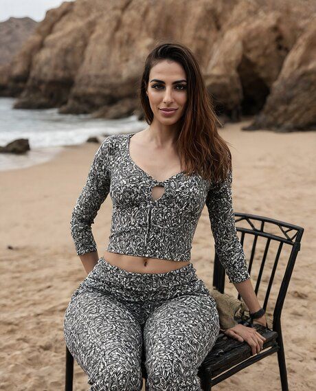 Solo girl with a slender build poses naked and in swimwear at a beach - #1
