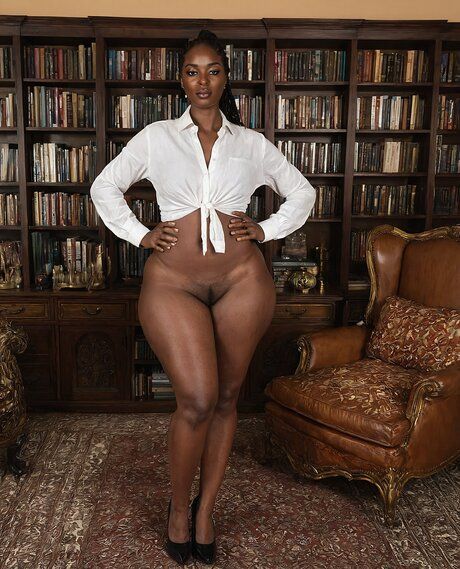 Fat black woman stands naked in a library after removing her clothes - #5