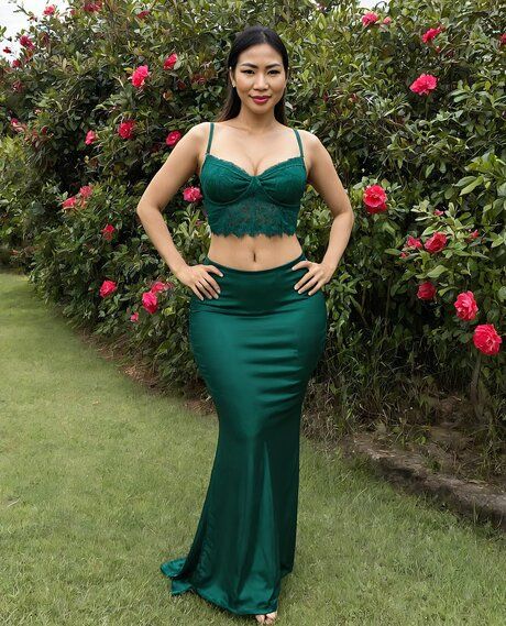 Beautiful Asian girl strips to put on a great nude show in her lush garden - #2