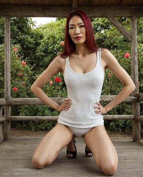 Redheaded Asian girl gets totally naked on a gazebo in a yard - #4