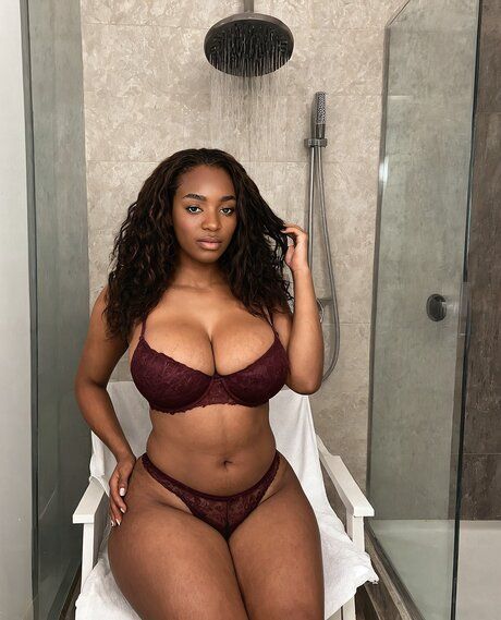 Pretty black girl removes a bodystocking to go nude in a bathroom - #4