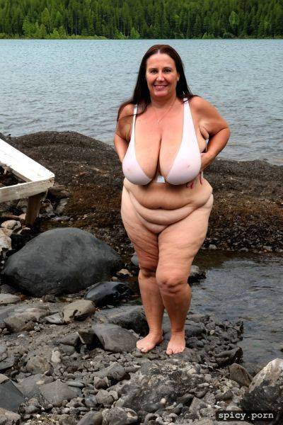 Color photo, standing straight at a mountain lake beach, hourglass figure - spicy.porn on pornintellect.com