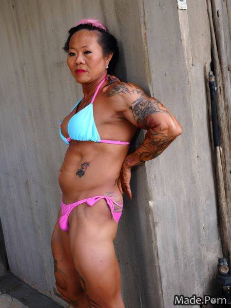 Tattoos bodybuilder top knot hair looking at viewer woman asian bikini AI porn - made.porn on pornintellect.com