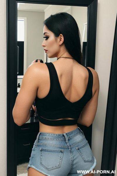 Heavy black eye makeup, crop top, jean shorts, from behind, in front of mirror, face visible - ai-porn.ai on pornintellect.com