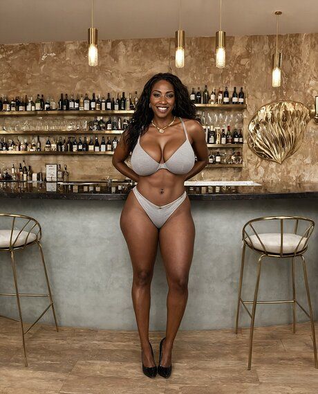Hot black girl with perfect boobs undressing to pose in the nude at a bar - pornpics.com on pornintellect.com